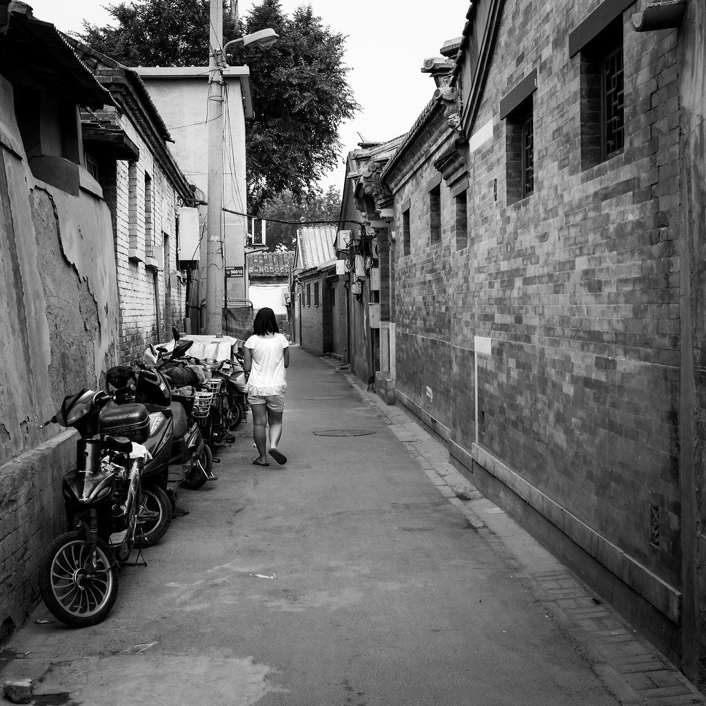 Quiet Beijing hutong alley with grey courtyard walls