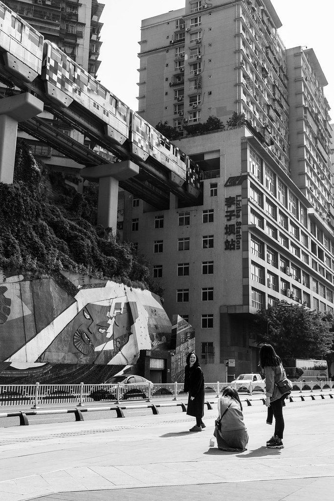 Liziba monorail train passing through apartment building Chongqing
