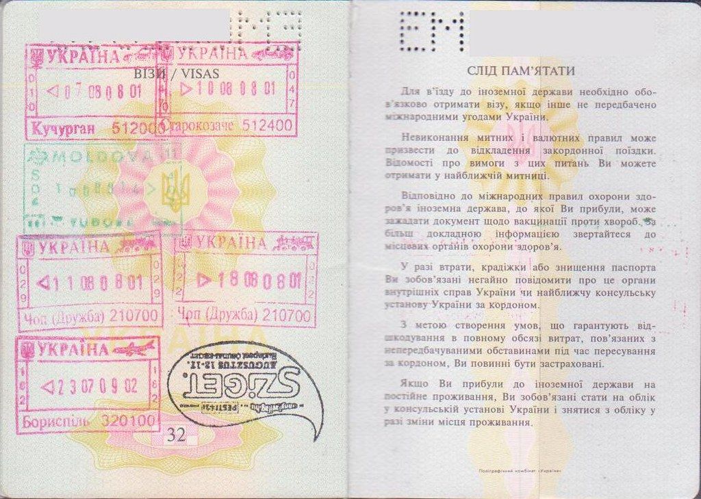 A visa and entry stamps inside a travel passport
