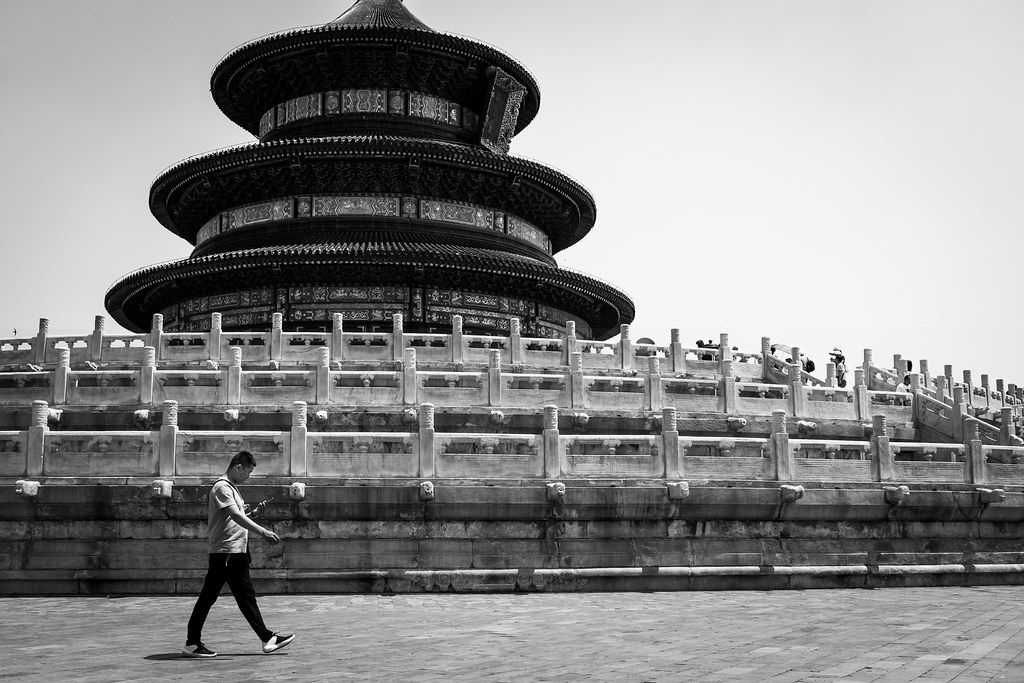 A traveler using a translation app on a phone in China