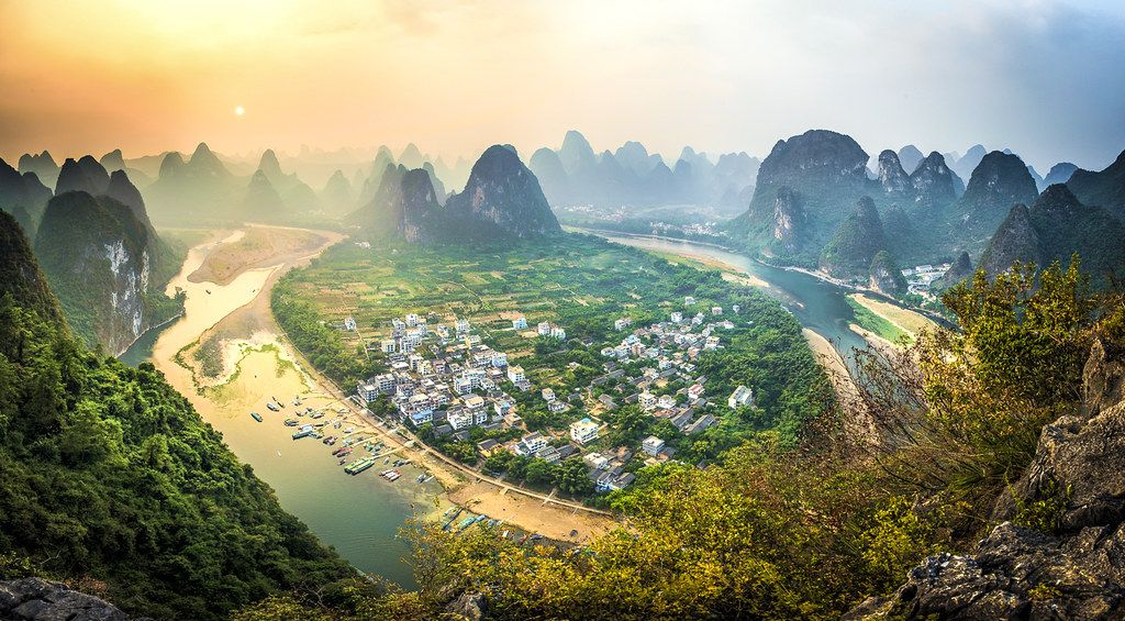 Sunrise cloud sea over Li River karst from a hilltop